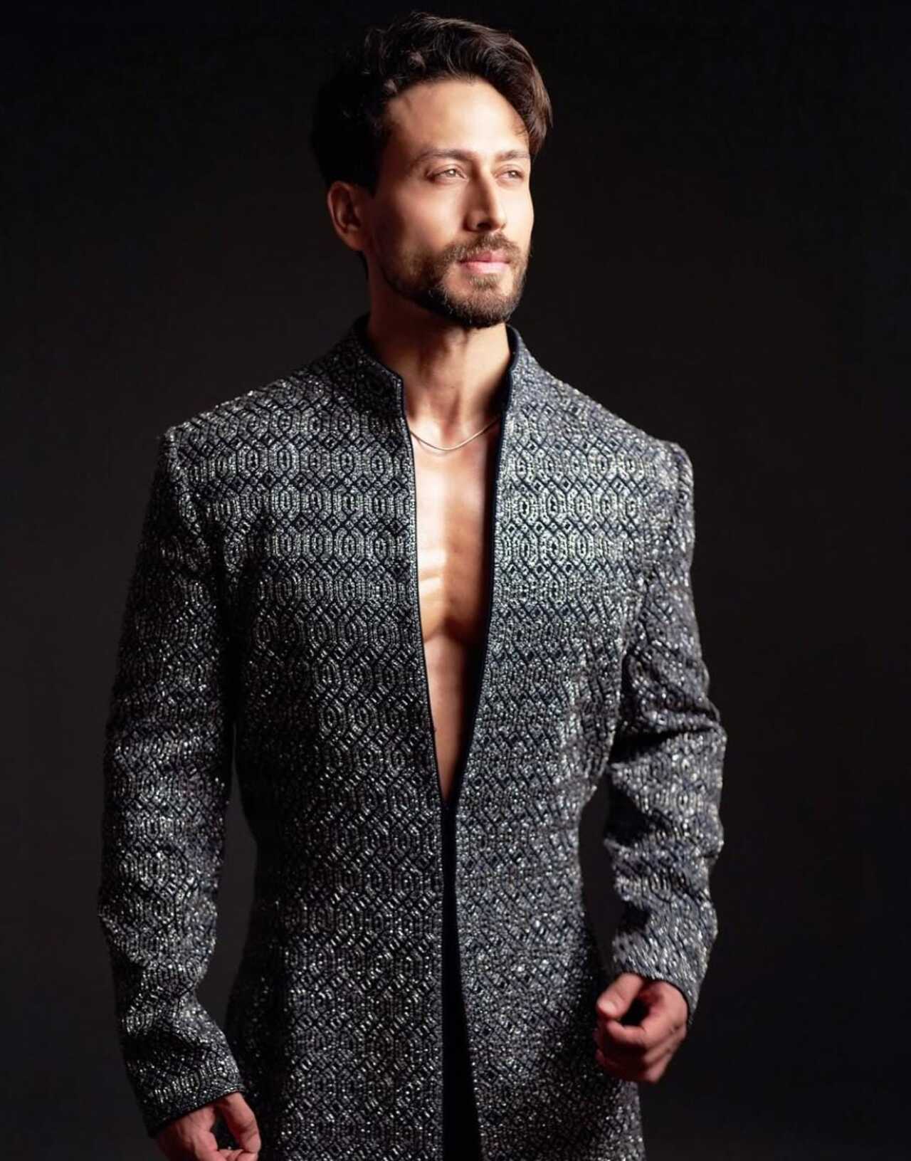 The heavy geometric metallic detailing to the traditional sherwani adds depth, luxury, and texture, making Tiger's look perfect for grand evenings or couture moments.
